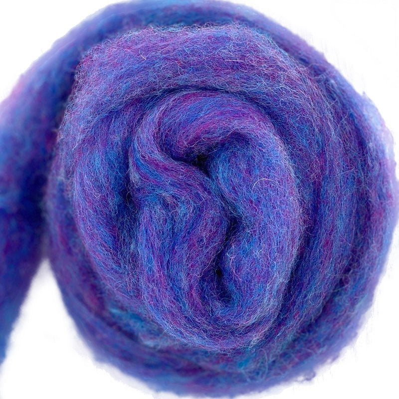 Bulky carded Corriedale wool roving in soft blue-purple melange with lavender and pink tones, from the Tutti Frutti Series